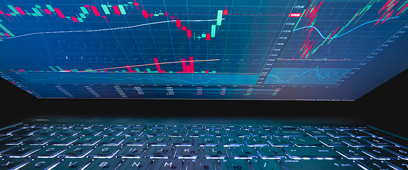 A laptop displaying forex data, emphasizing the connection between technology and indices trading.
