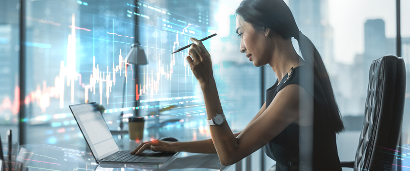Woman trader checks MetaTrader 4 platform and starts trading with IronFX.