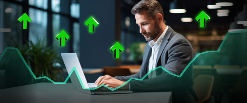 A man in a suit engages in cfd trading on a laptop, with an upward arrow indicating positive market trends.