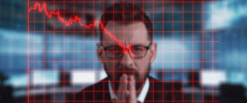 A suited man studies a graph, focusing on data analysis and interpretation in a business environment.