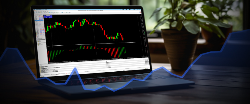 close-up of a laptop screen displaying forex trading charts, with a hand poised over the keyboard, indicating active trading.