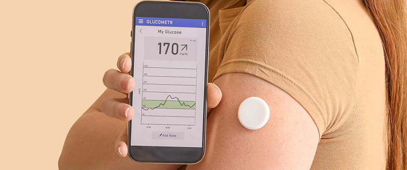 A woman is seen holding a smartphone that shows a thermometer, suggesting she is checking her temperature.