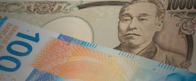 A Japanese banknote featuring a detailed portrait of the emperor, showcasing traditional design elements and colors.