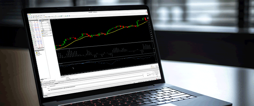 A laptop featuring a trading chart on the display, representing financial data and market performance.