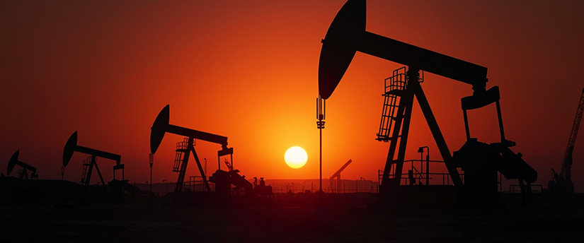 Crude oil pumpjacks representing oil production and API gravity differences between crude grades
