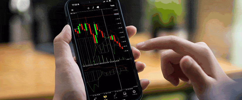 Oil market chart on a mobile device illustrating crude oil price movements and trading activity